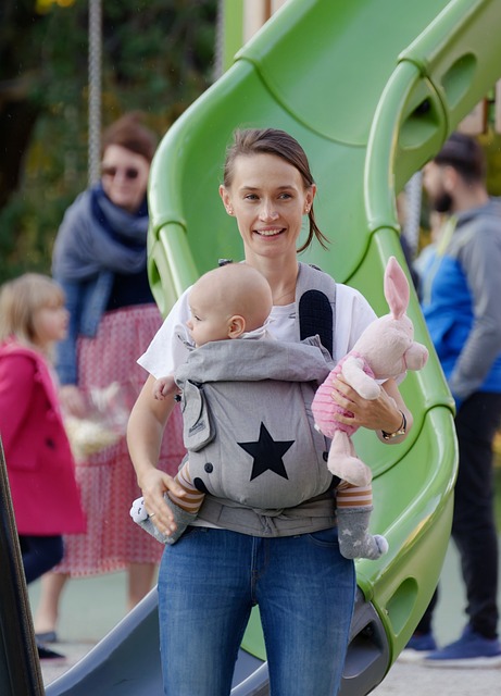 mom carries baby in baby carrier