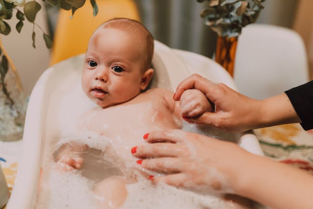 newborn in bathtub